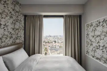 European-style master bedroom in a flight steward's 2-bedroom with study condominium along Sims Drive.