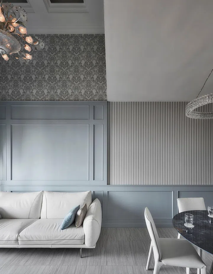 Grey blue wainscot living room walls Living room in a flight steward's 2-bedroom with study condominium along Sims Drive designed by The Cottage Crafts.