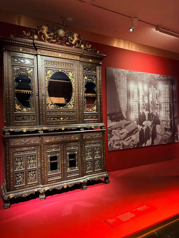 A European-style Teakwood Cabinet on the left. On the right hand side is an image of a Straits Chinese’s bridal home with beaded slippers, shoes, and gifts displayed in a similar cabinet in the 1920s - courtesy of The Peranakan Association Collection, National Archives of Singapore.