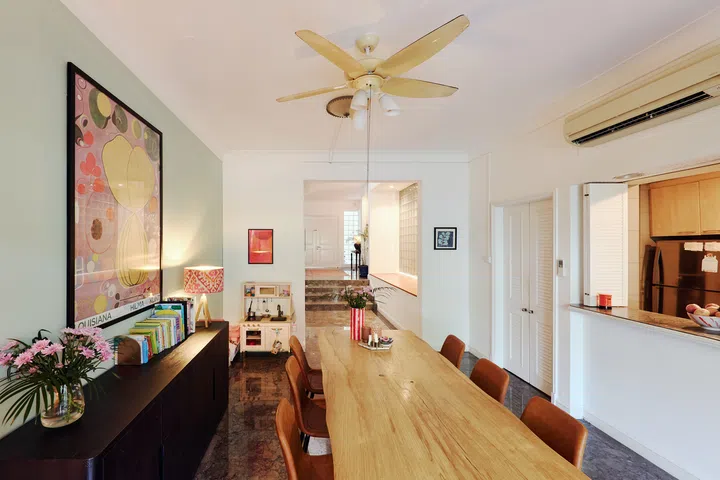 Statement walls are painted to echo colours the family had used in previous homes, while furniture, artwork and  books travelled with them from one rental to the next.