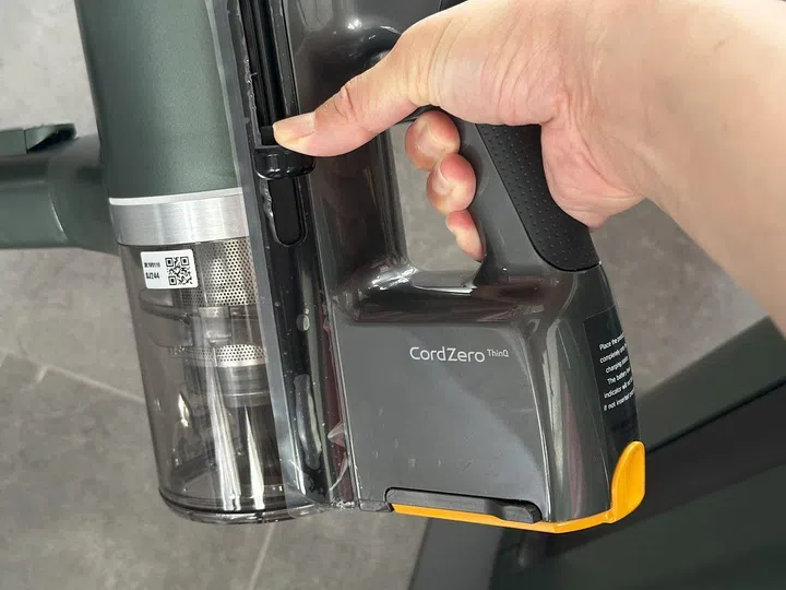 The LG stick vacuum cleaner Kompressor “technology” is a physical lever on the side of the bin that compacts collected dust to give you more space in the bin.