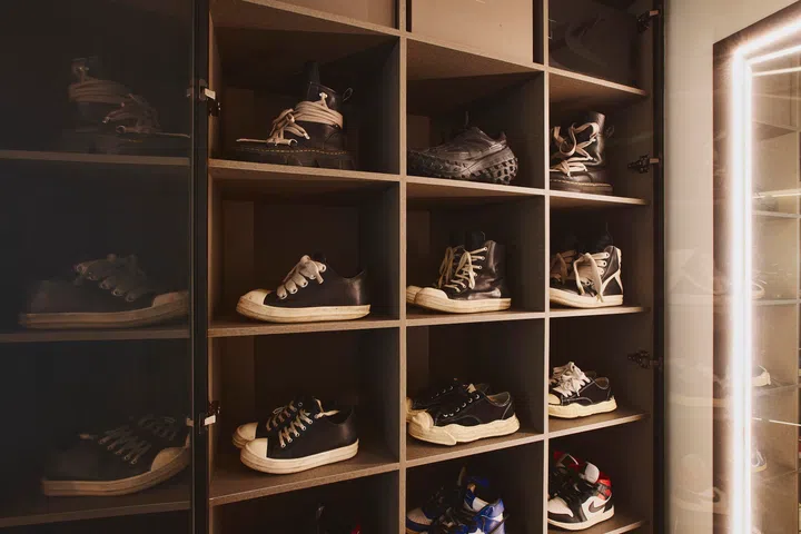 One of Darren’s favourite designers is Rick Owens, which you can tell from the lighting advisor’s favouring of dark colours. 
