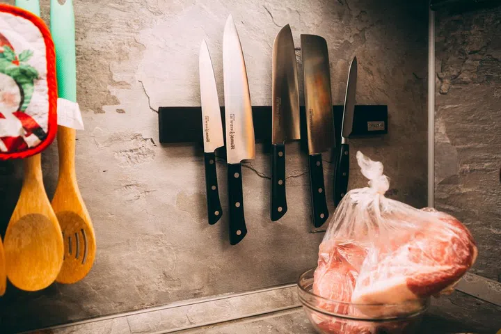 A well-organized kitchen corner showcases a collection of sharp knives.