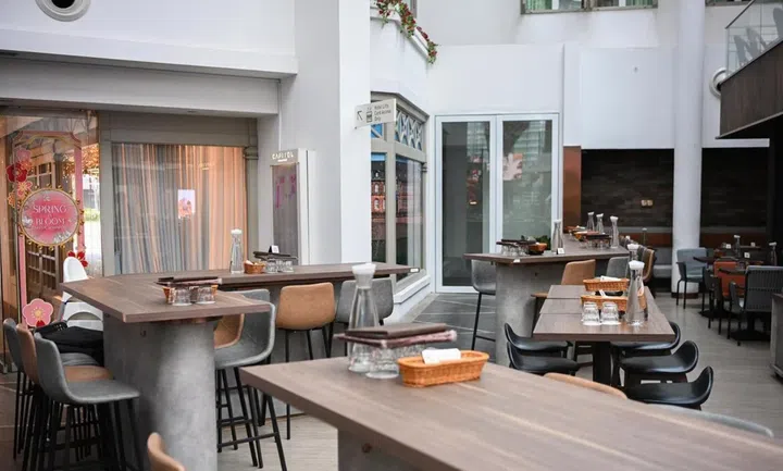 With his co-founders and staff, Mr Yip fabricated and assembled the tables in the bar.