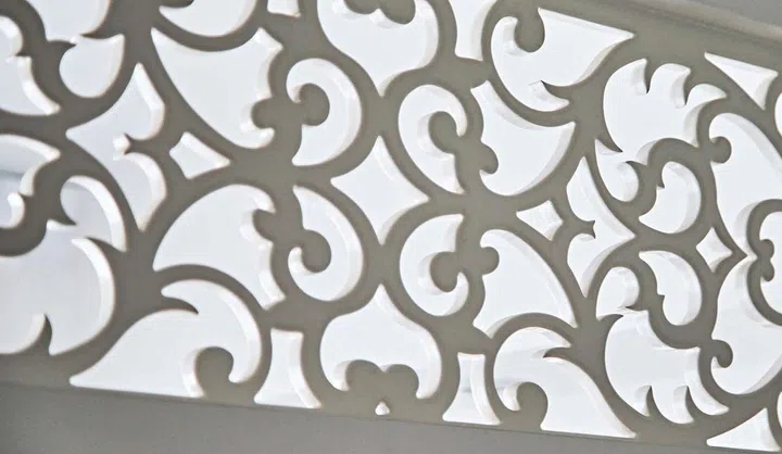 Custom filigree above the doors enriches the colonial aesthetics.