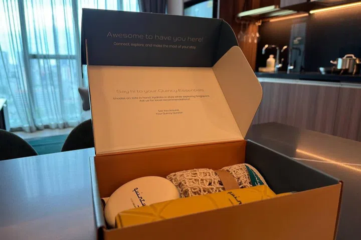 See You at Quincy kit for Quincy House check-in guest placed on the dining table.