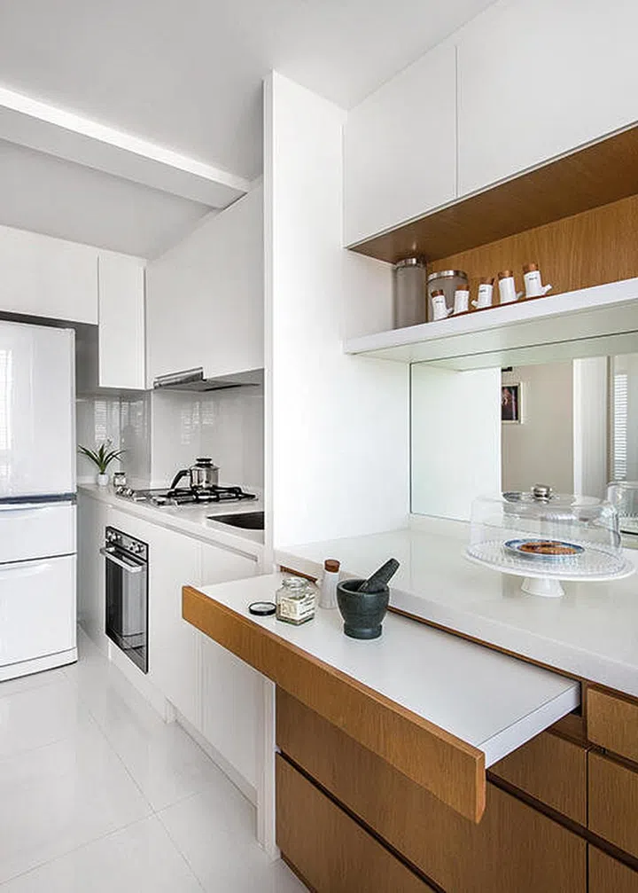 Pull-out table in the Kitchen by The Interarch Design