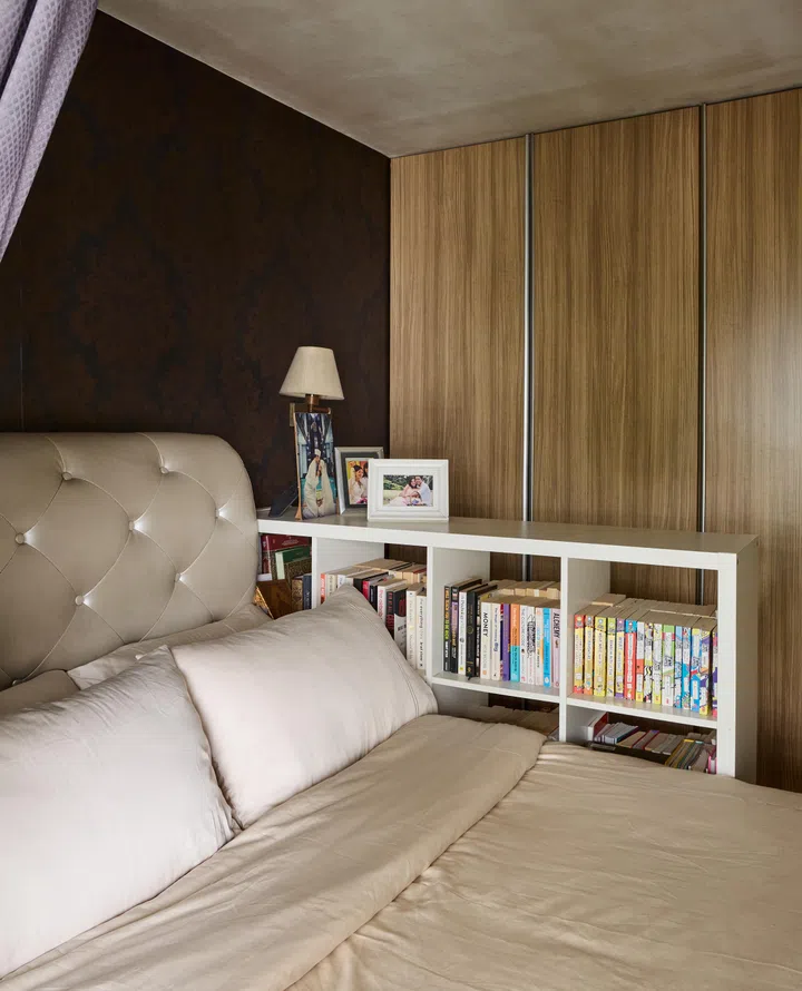 A bookshelf in the master bedroom for avid readers.