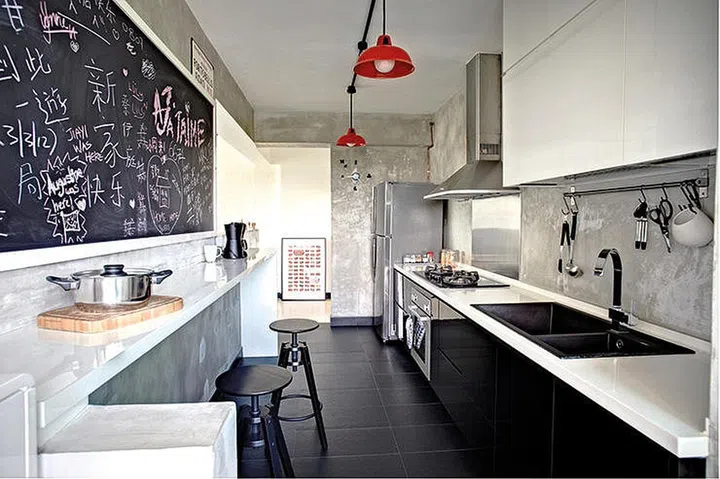 If you prefer sticking with the layout you've been given in your HDB flat, why not split the long kitchen right down the middle and have one side for countertop dining?