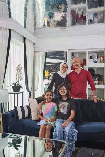 A nurse and teacher, their two young daughters and two cats live in this 5-room HDB DBSS at Ang Mo Kio Street 52 (1,206 sq ft), designed by Black & White Haus.