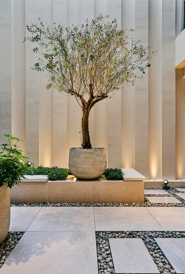 At the heart of this home, the tree anchors family life and flow.