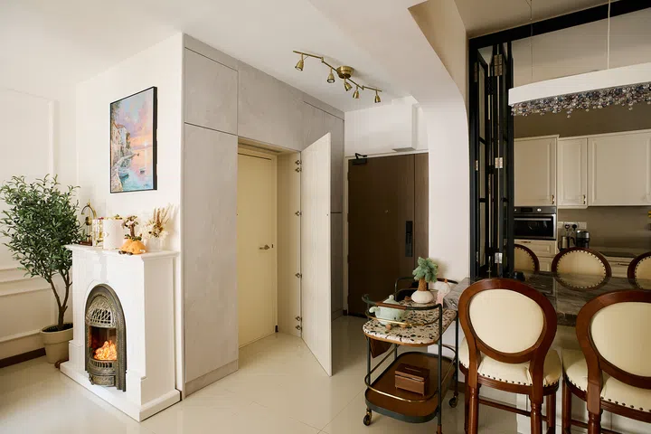 Full-height cabinetry conceals the household shelter while adding storage beside the entrance.