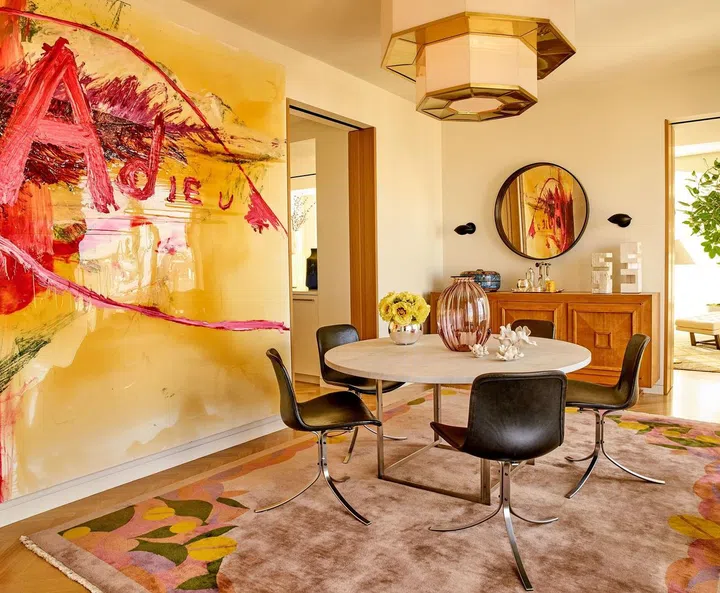 Jimmie Johnson's dining room in his New York City apartment features a showpiece by American painter and filmmaker, Julian Schnabel. Image by François Dischinger