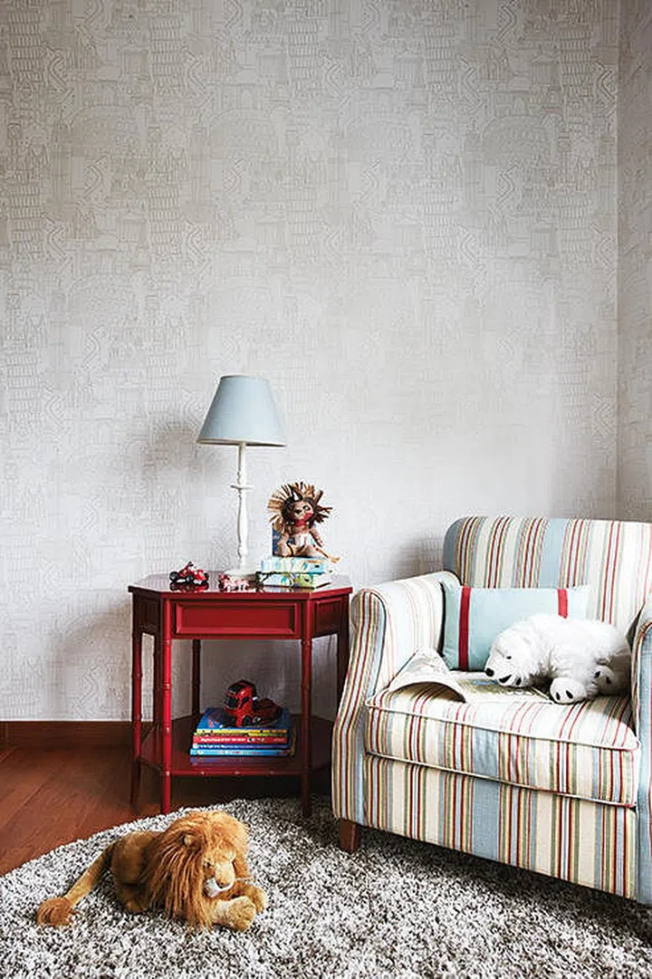 Hints of red add a youthfulness to the child’s bedroom. Interior design by Design Intervention