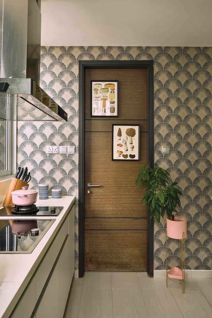 A beautiful gingko patterned wallpaper clads the wet kitchen walls.