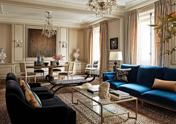 Soothing colours clash with bold highlights in the living room.