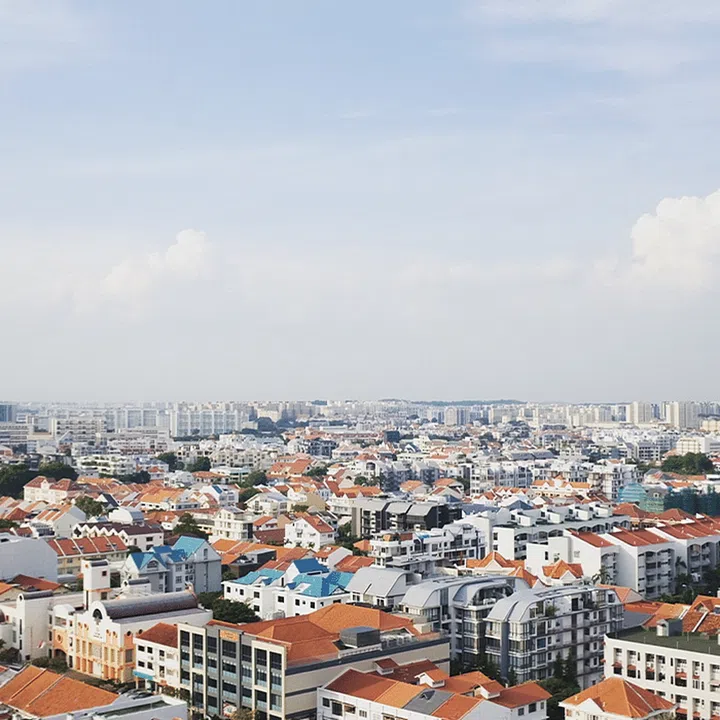 Aerial view of apartment buildings dotting a city skyline. Image Unsplash