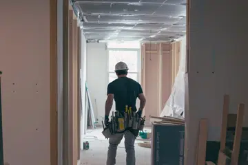 Back view of a professional renovation team working on interior home improvements