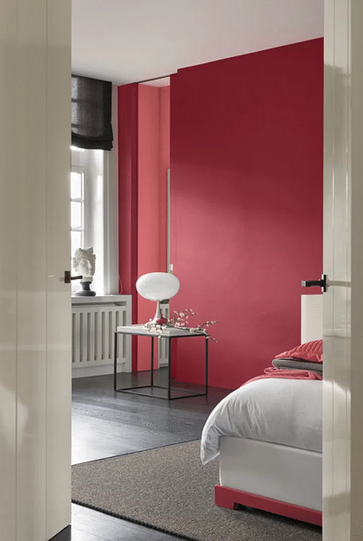 Red wall paint in a bedroom. Image by Akzo Nobel.