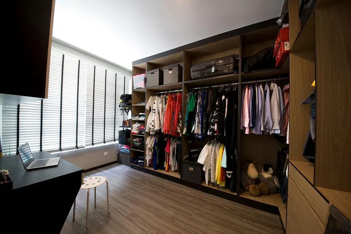 The spare bedroom was turned into a grand walk-in-wardrobe for the whole family.