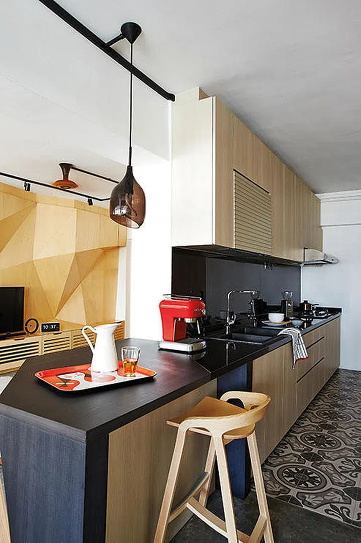 This open concept kitchen design cleverly hides any clutter within the kitchen from plain sight. Interior design by Produce.