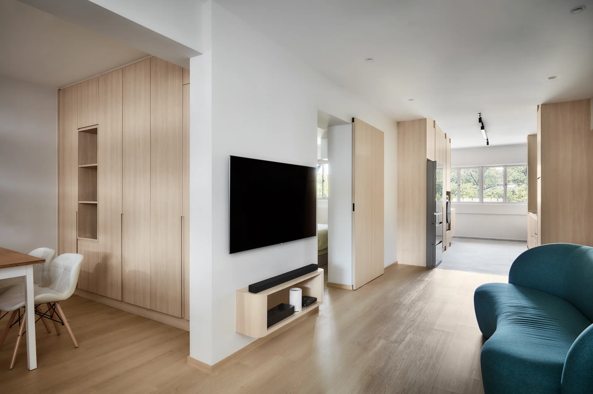 Retiree Nancy Teo wanted her new 3-room HDB resale home to feel bright. So, interior designer Don Wong chose lighter colours for the living and kitchen areas.