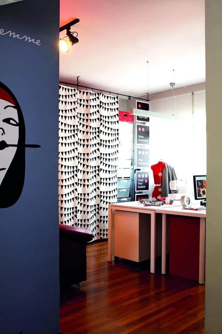 The study room is where the homeowner does her sewing. The tools and fabrics are all stored neatly with the help of a good storage system.