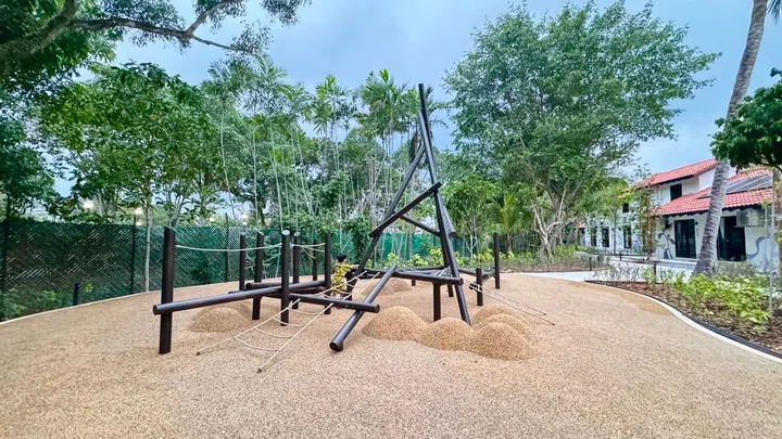 Outdoor nature play area with climbing structures, where children and adults can have some fun.