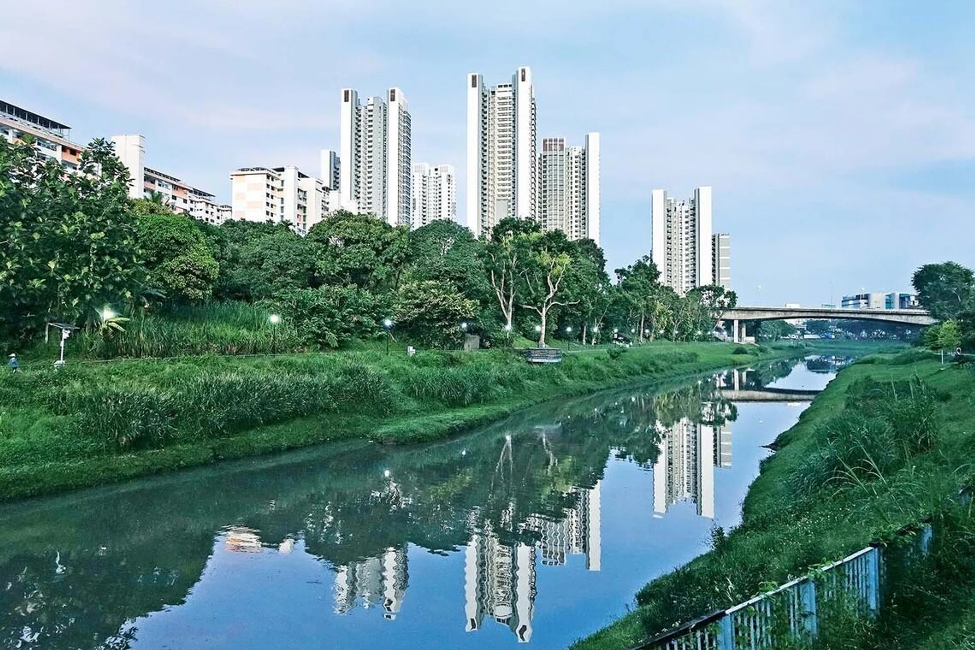 The new Clementi NorthArc HDB flats (tall buildings) are seen reflected in the Sungei Ulu Pandan canal on May 4, 2023.