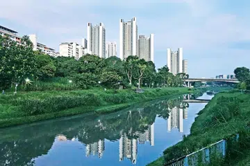 The new Clementi NorthArc HDB flats (tall buildings) are seen reflected in the Sungei Ulu Pandan canal on May 4, 2023.