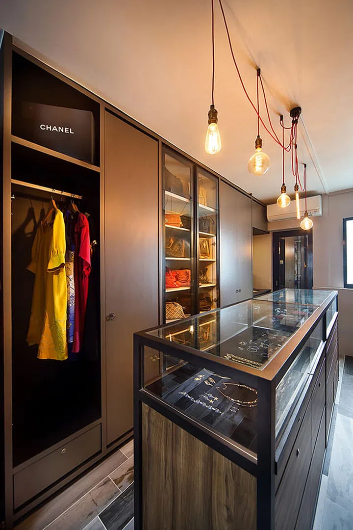 The client gets to immerse in a world of her own with a walk-in-wardrobe which resembles a 'mini boutique' with its large accessories cabinet and shelves built for handbag storage.