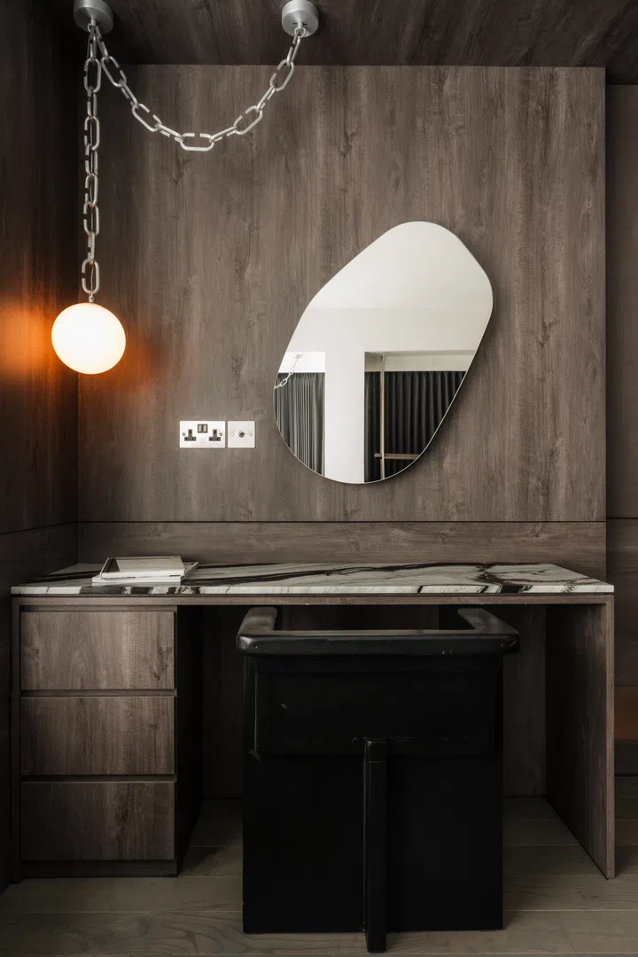Boba Chain pendant lamp hangs above a vanity in the master bedroom.