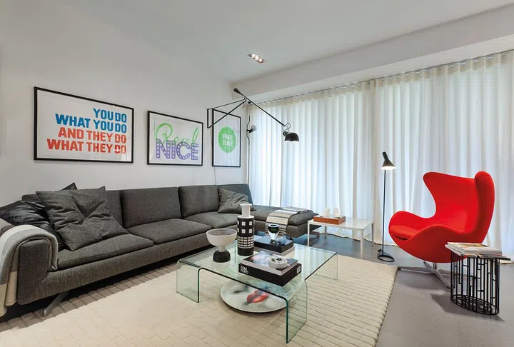 The creative factor is played up by the graphic art lining the walls and studio lights, but the overall looks is softened with the generous use of textures and fabrics.