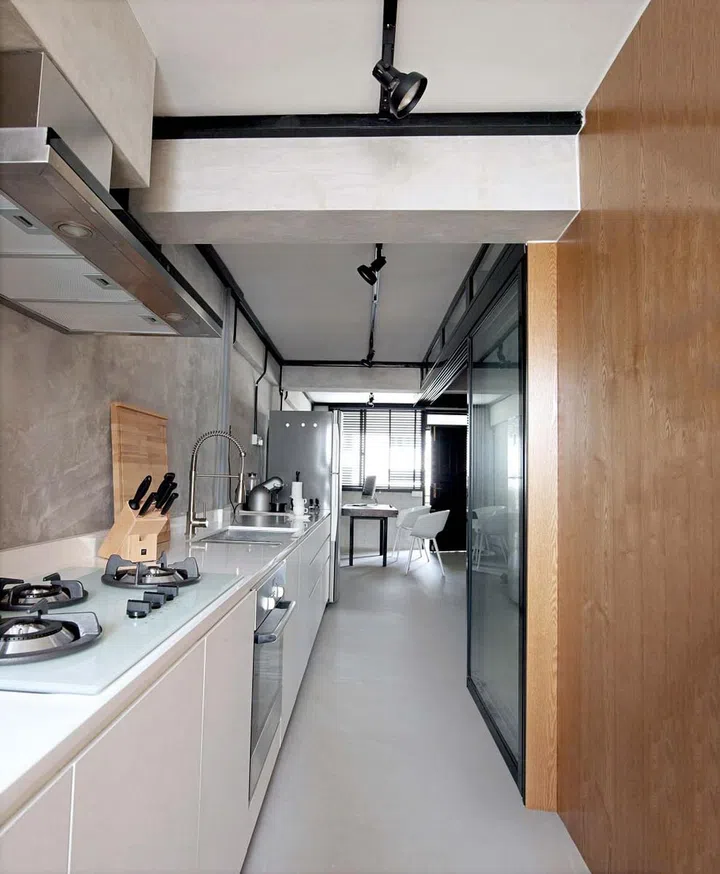 Kitchen in a 700 sq ft 3-room HDB bachelor's pad.