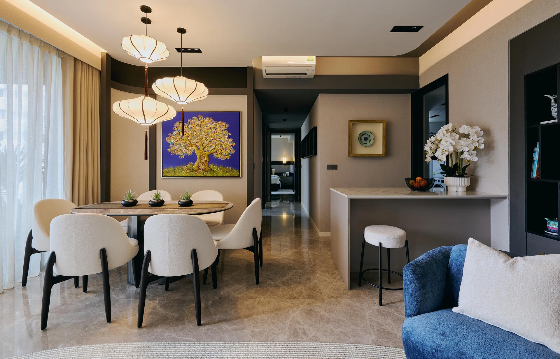 An open layout links the dining, kitchen island, and living spaces, creating flow and connectivity.