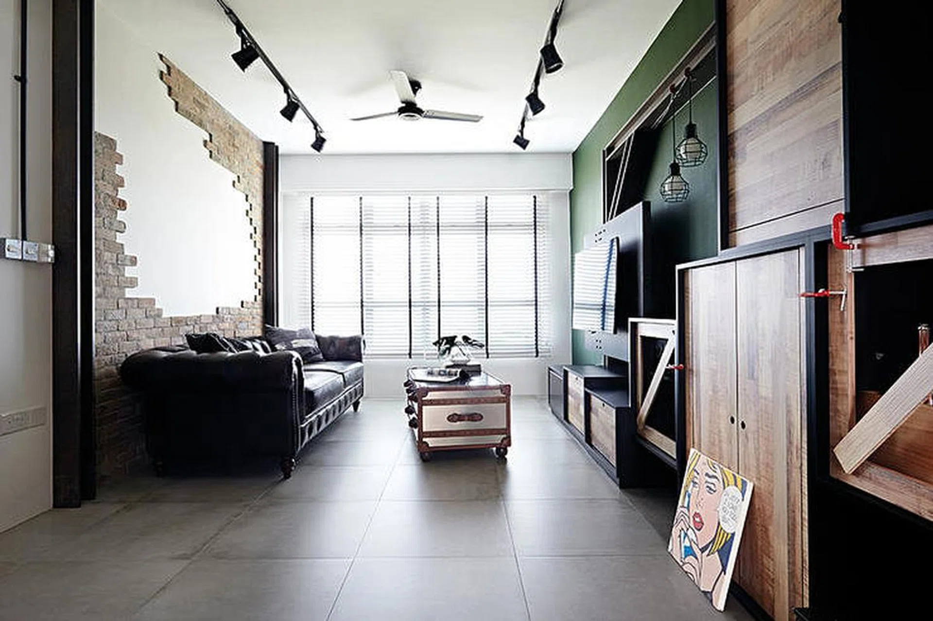 Large format floor tiles in a 4-room HDB flat.