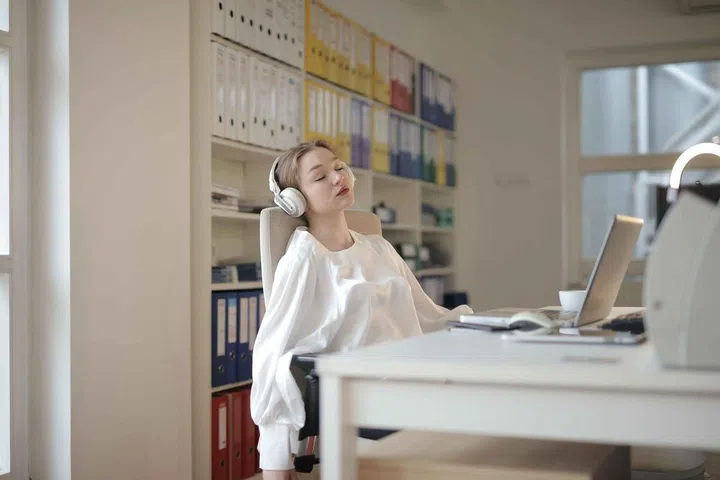 How to Sleep Better? An Ear Nose Throat Doctor Shares Expert Tips. Woman dozing off at work desk
