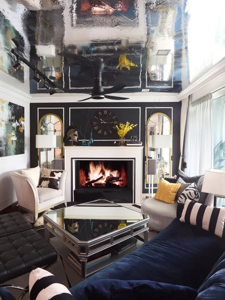 The living room is lined with a mirrored ceiling.