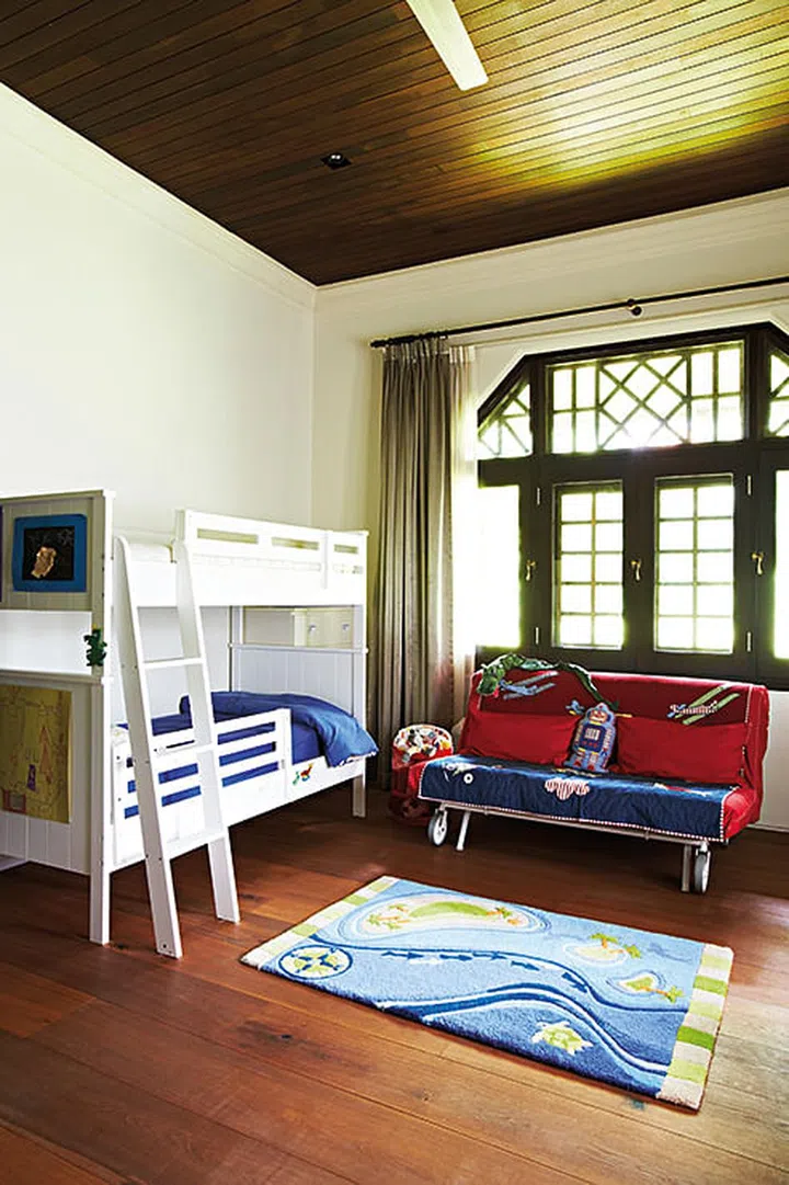 The two young sons each have their own room, but a double-decker set was chosen for this one as friends often drop by for sleepovers. Interior design by Mofasis