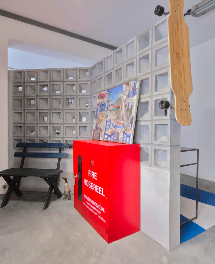 The family repurposed a real fire hydrant, now used for storing their shoes. 