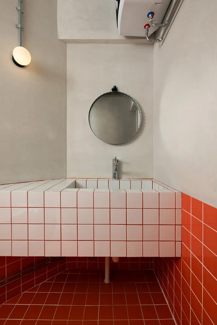 The bathroom, where tiles were inspired by swimming pools.