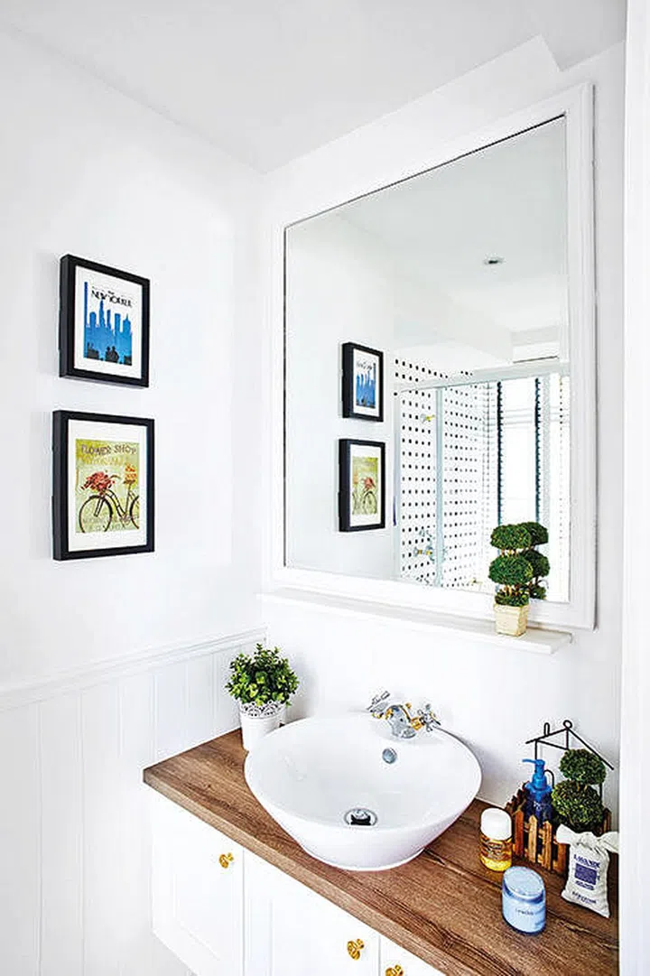 All white and wood bathroom vanity sink countertop. Interior design by JQ Ong from The Association