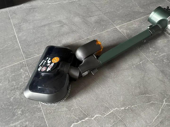 Fortunately, unlike the wide brush head, the mop head allows the vacuum to be swiveled flat on the side to reach under furniture.