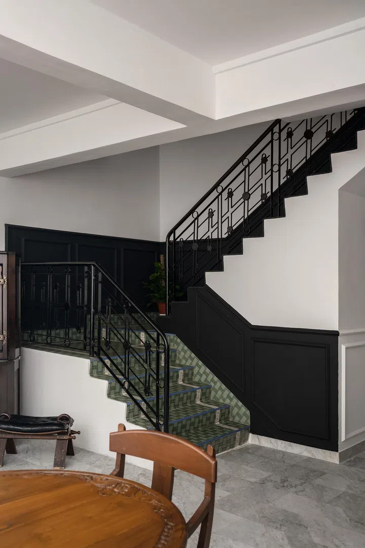 Muted green mosaic tiles on the staircase were retained as a sentimental feature of the family’s heritage.