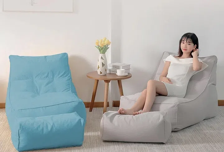 lady on a bean bag with stool