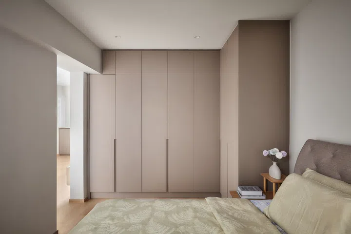 Full-height wardrobe and a king-sized bed fits into the master bedroom.