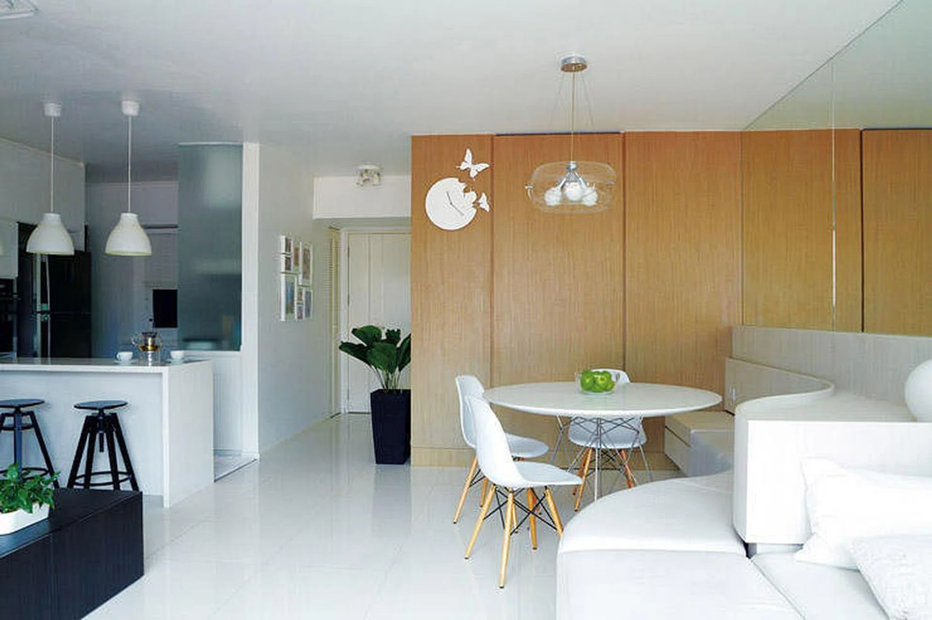 Living and dining room in a 990 sq ft minimalist 4-room HDB.