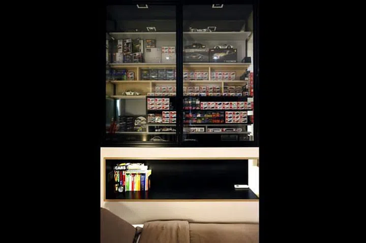 Josh's car models, which he has been collecting since he was five, are kept in a glass display cabinet in his bedroom.