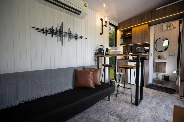 Lazarus Island Tiny House room review - view of sofa and living area