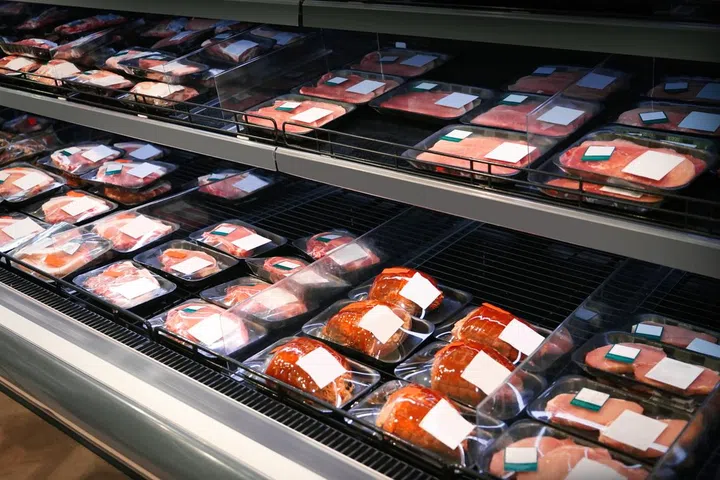 Shelves with fresh meat in supermarket